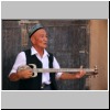 ein uigurischer Rubab-Spieler bei den Tausend-Buddha-Höhlen von Bezeklik